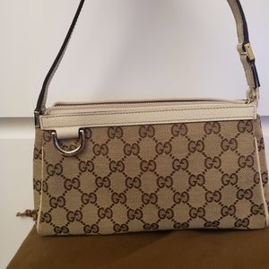 Authentic Gucci beige monogram pouchette